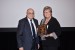 Dr. Nagib Callaos, General Chair, giving Prof. Lorayne Robertson a plaque "In Appreciation for Delivering a Great Keynote Address at a Plenary Session."